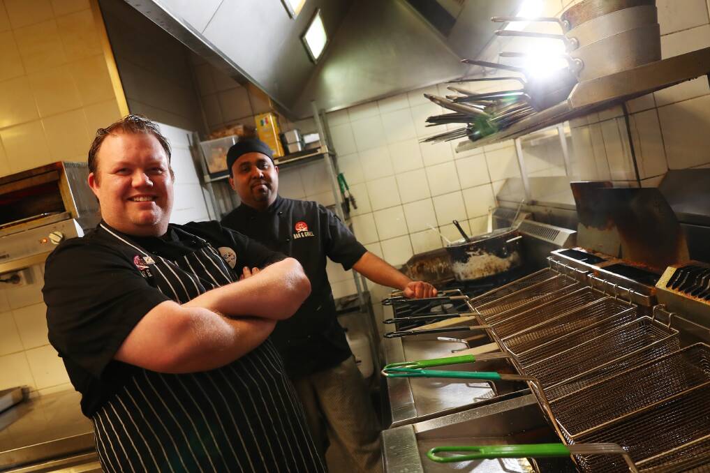 Shaun McFarlane and Chaminda Deva practice creating top dishes. Picture: Emma Hillier