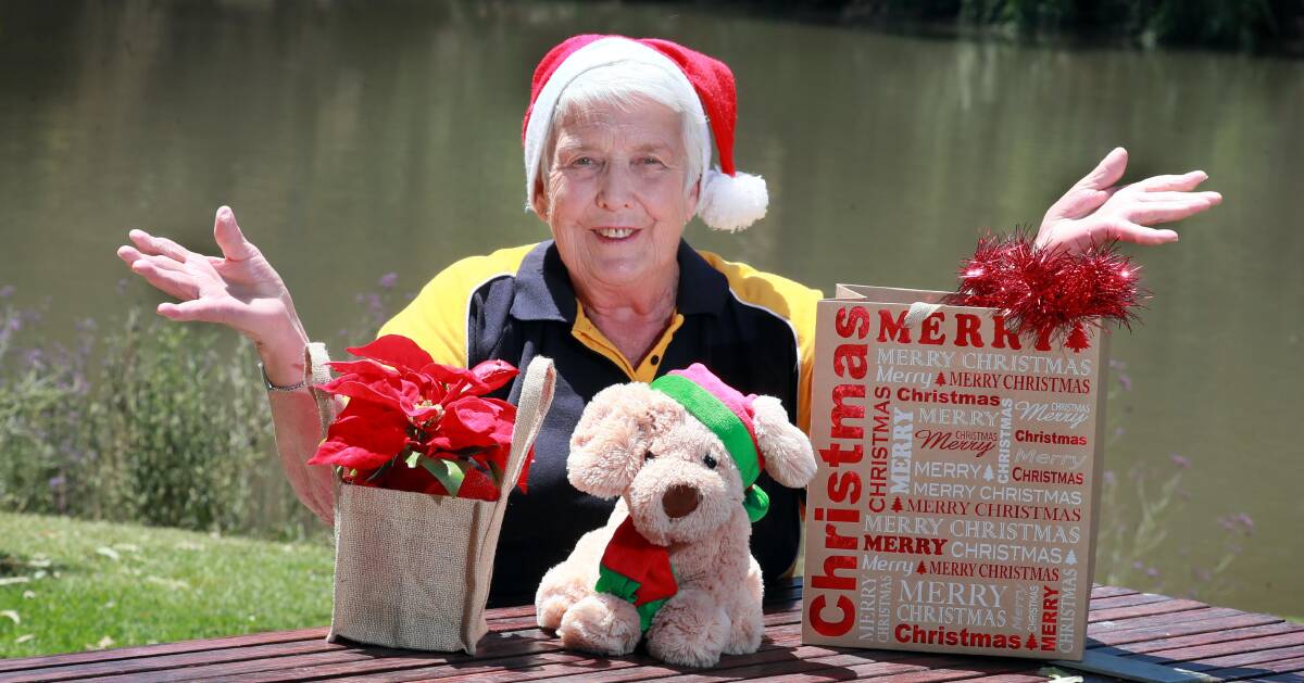 FESTIVE FUN: Wagga Sunrise Rotary service director Joan Skews is just waiting on a fresh tree to top off her Christmas decorations. Picture: Les Smith