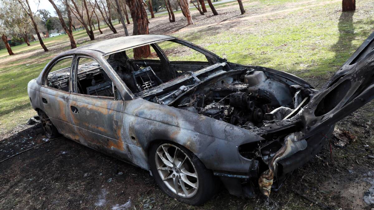 A Holden sedan was found burnt out in Ashmont's Webb Park. Picture: Les Smith