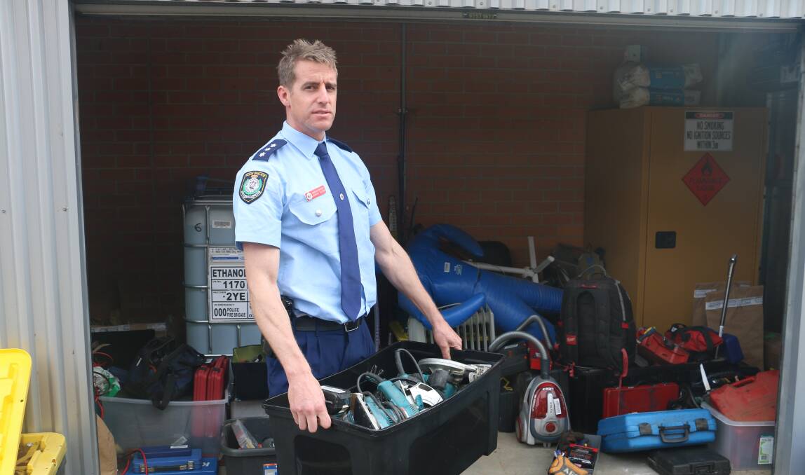 HUGE HAUL: Riverina Police District Detective Inspector Adrian Telfer says there is still a shed full of tools and equipment, from drills to vacuum cleaners, waiting to be reclaimed at Wagga Police Station. Picture: Jessica McLaughlin