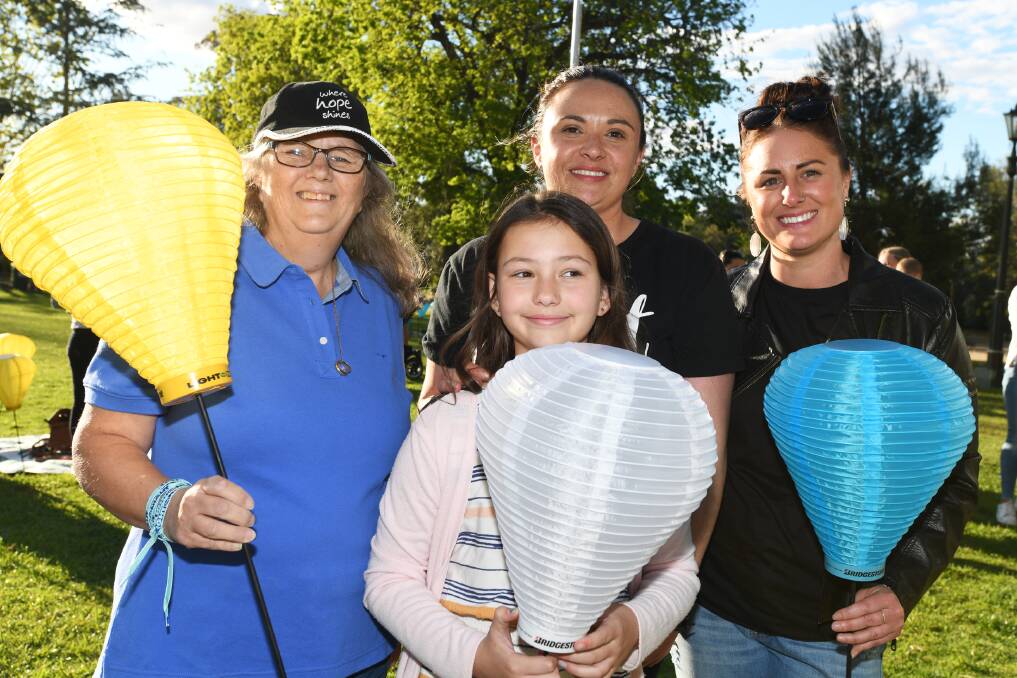 SHOW OF SUPPORT: Chris Armstrong, Taylor Garrett, 9, Rachelle Mintern and Jacqui Malcolm each hold different lanterns, demonstrating the ways blood cancer has affected them.