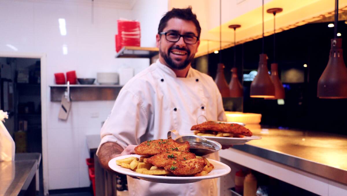 DELICIOUS: Kooringal Hotel's Head Chef Ryan Dedini is adamant they produce Wagga's best chicken schnitzel. Picture: Jessica McLaughlin