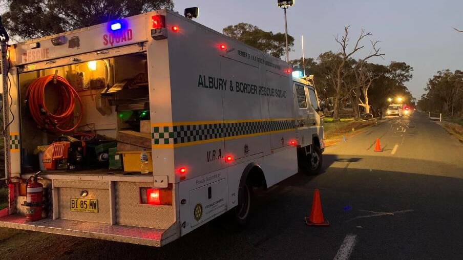 ASSISTANCE: Albury and Border Rescue Squad members help police with lighting at the scene of the car crash. Picture: Facebook