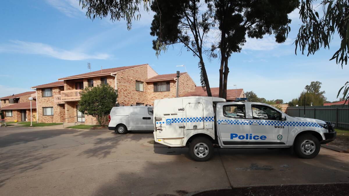 CRIME SCENE: Forensic units and police remain on scene at the Bruce Street unit block. Picture: Les Smith