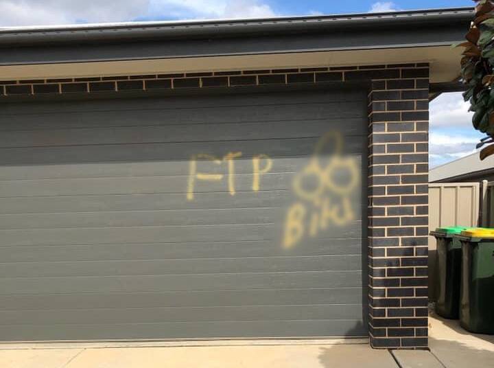 A Boorooma home had yellow spray paint left on their garage door on Sunday night. Picture: Contributed