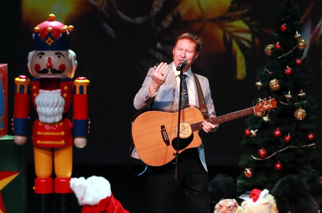 FESTIVITIES: Darren Coggan well and truly gets into the Christmas spirit on Wagga Civic Theatre's stage, giving an energetic performance to Wagga's older generations. Picture: Les Smith