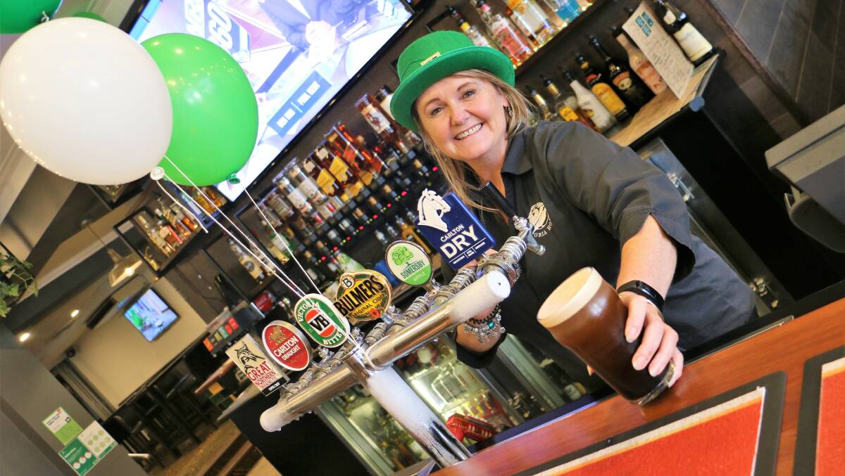 LUCKY DAY: Lisa Kennedy pours the perfect Guinness at the Victoria Hotel in the spirit of St Patrick's Day. Picture: Jessica McLaughlin