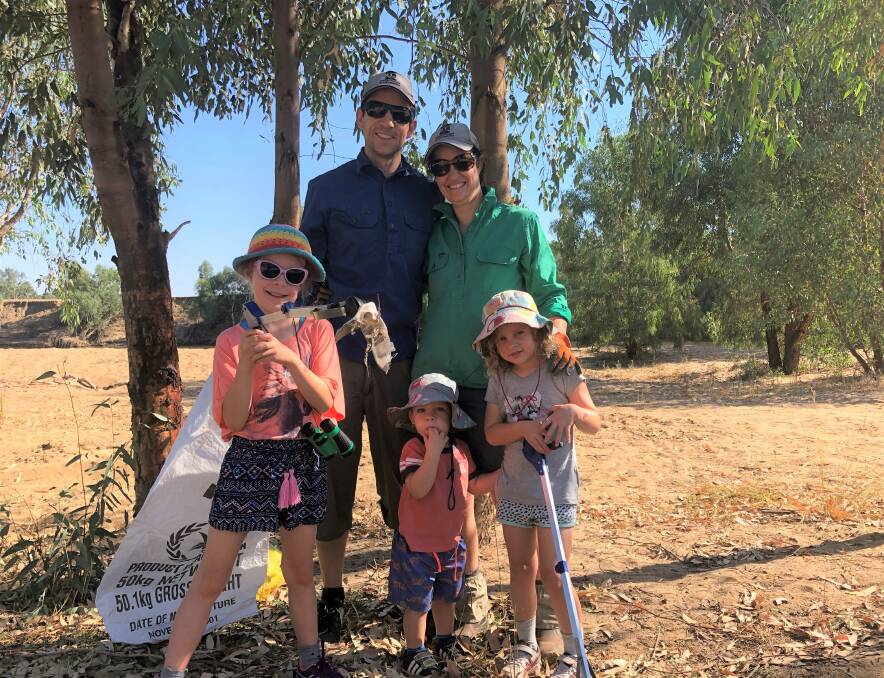 The Maher family set out to clear the Murrumbidgee river banks for their first Clean Up Australia Day, with Tahlia, 6, Ed, Kaden, 2, Nicole, and Alani, 4. Picture: Jessica McLaughlin