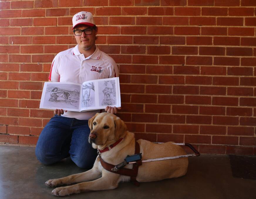 HELPING PAW: Joel Jensen knows his way around a sketchpad but guide dog Nicci offers moral support. Picture: Jessica McLaughlin