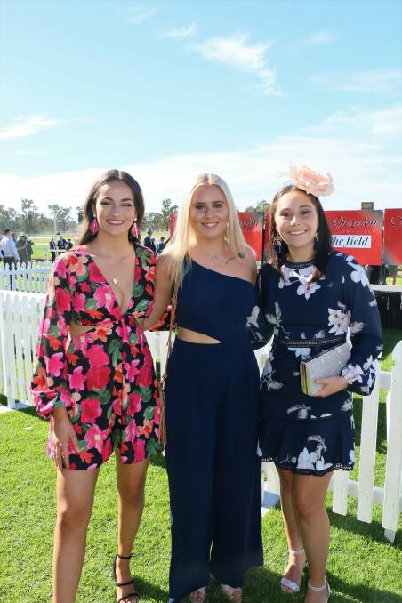 STUNNING: Claudia Di Trapani, Paige Breust and Georgia McCaulay stole the show in floral outfits, making the most of the big day. Picture: Jessica McLaughlin