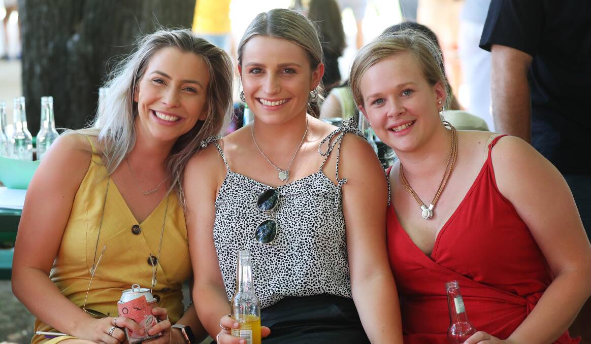 STYLISH: Monique Luff, Chelsea Tout and Clare Chalmers sip on cool drinks and take a break from the sun.