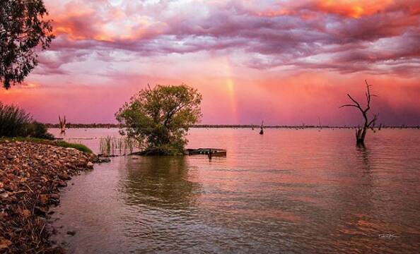 STORMY SKIES: Winner of week three's People's Choice Award @thebrewski_effect snapped a colourful storm passing over Lake Mulwala.