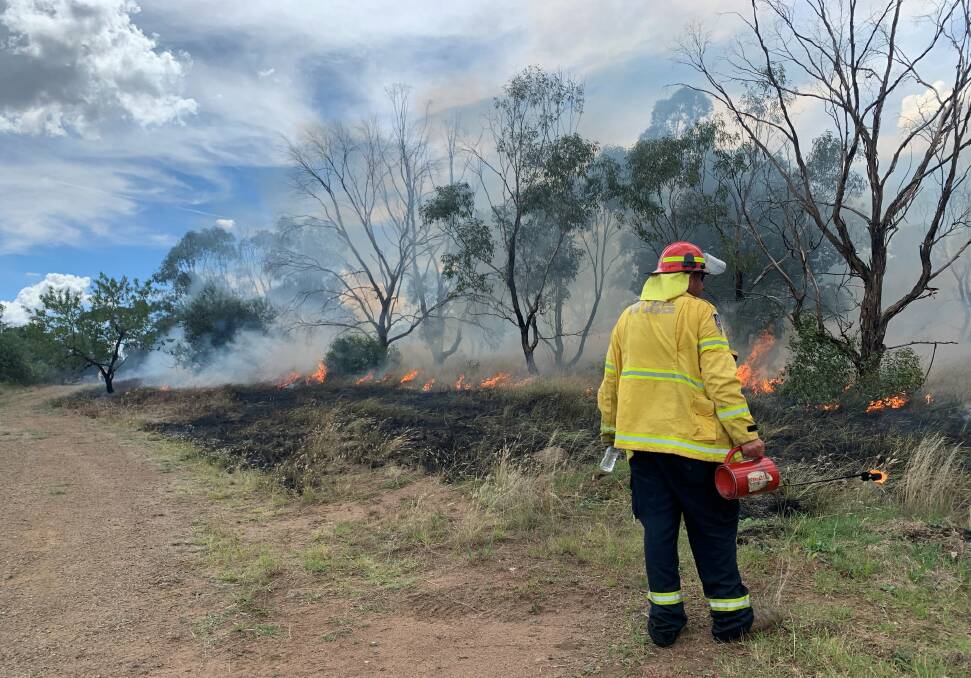 Junee RFS units work on a hazard reductino burn at Rocky Hill Reserve. Picture: NSW RFS