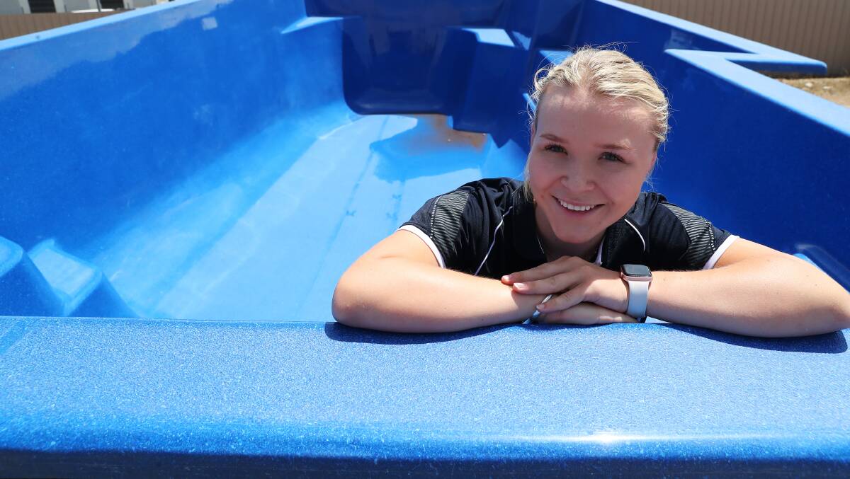 DIVE IN: Alexis Pollard shows off one of their pool options available at Freedom Pools. Picture: Emma Hillier