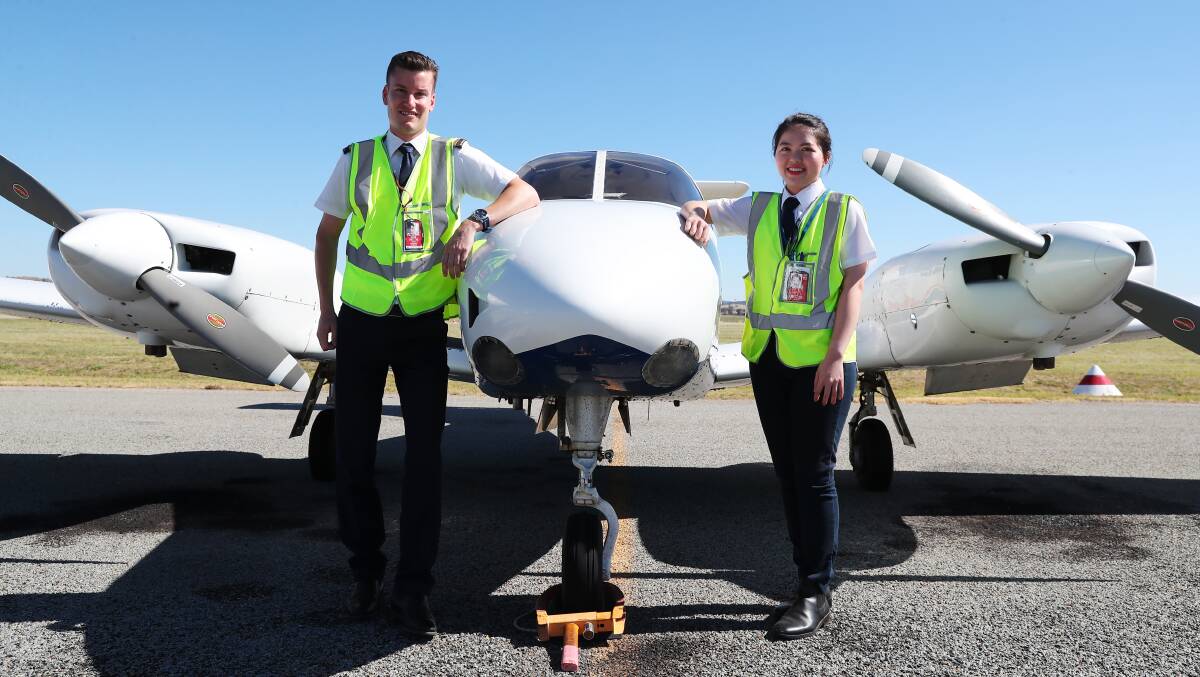 FLIGHT PATH: Pilot instructor Stuart Stanhope and student Savannah Le at the REX Pilot Academy in Wagga. Picture: Emma Hillier