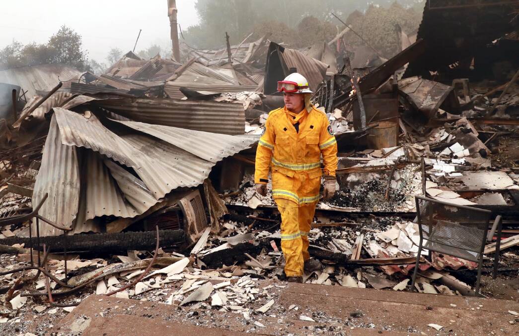Chris Gibson with the Dareton fire brigade at the site of the old hospital in Batlow. Picture: Les Smith