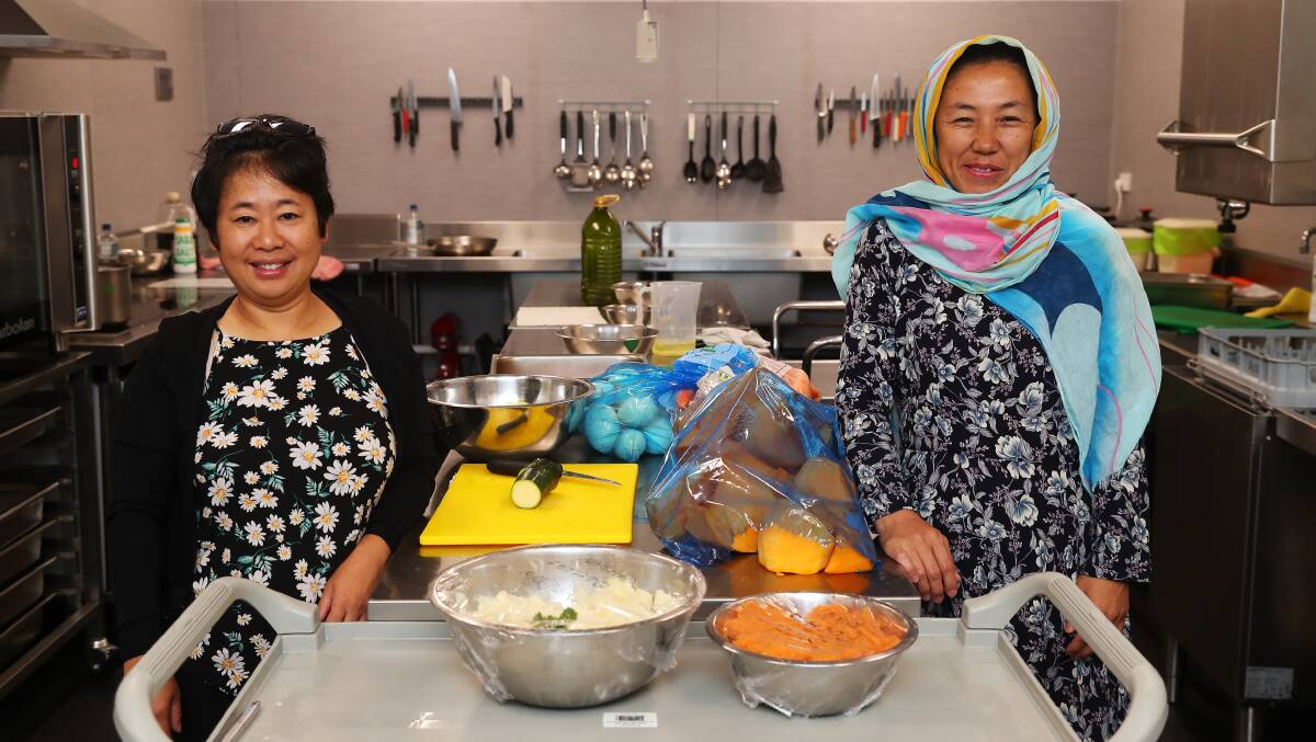 DELICIOUS: Htu San La Bang and Hakimeh Rahimi teach Wagga how to cook their favourite traditional dishes. Picture: Emma Hilleir