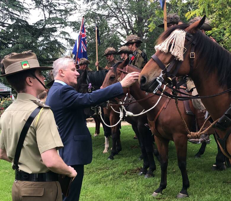 Captain Matthew Deahm with Deputy Prime Minister Michael McCormack and Saturday's memorial service in the Victory Memorial Gardens. Picture: Contributed