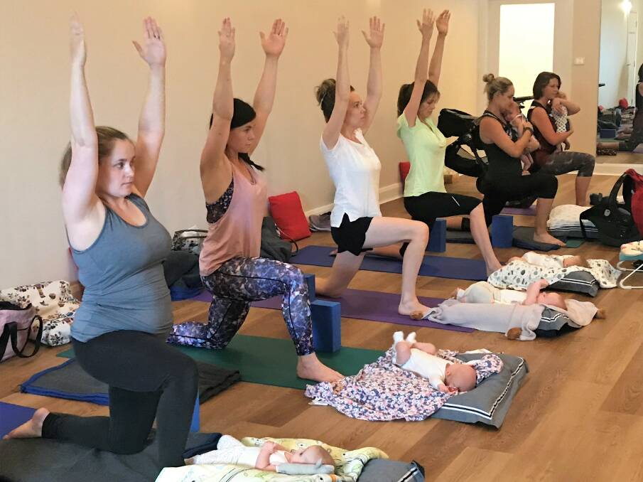 STRETCH: Pre and post-natal yoga instructor Tiff says the class helps to strengthen the mothers' bonds with their babies. Picture: Jessica McLaughlin