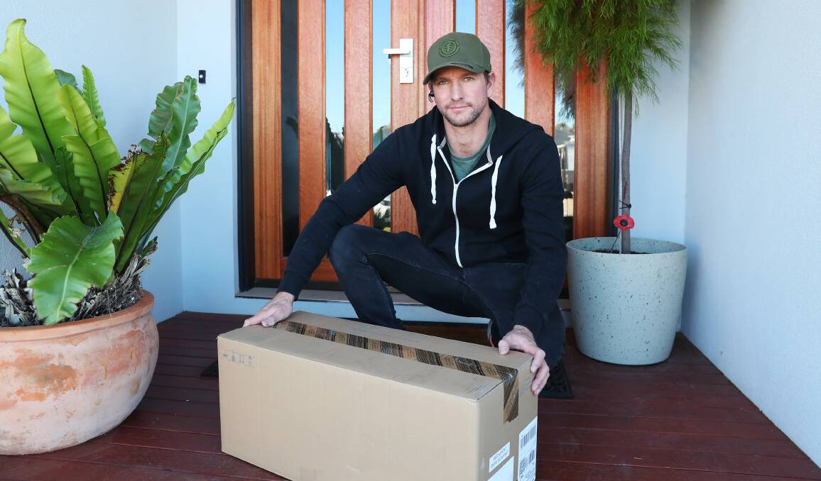 SECURITY: Tim Wilson has a close eye on his package deliveries, even when he's not at home, after installing security cameras at his front door. Picture: Emma Hillier
