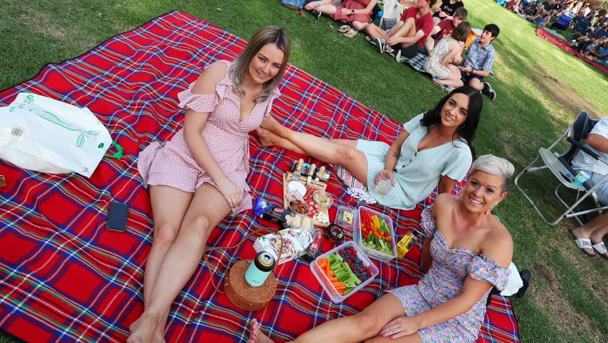 LADIES' NIGHT: Meagan Clark, Jess Geppert and Tegan Veliscek made a night of it in the gardens with a cheese platter to share. Picture: Emma Hillier