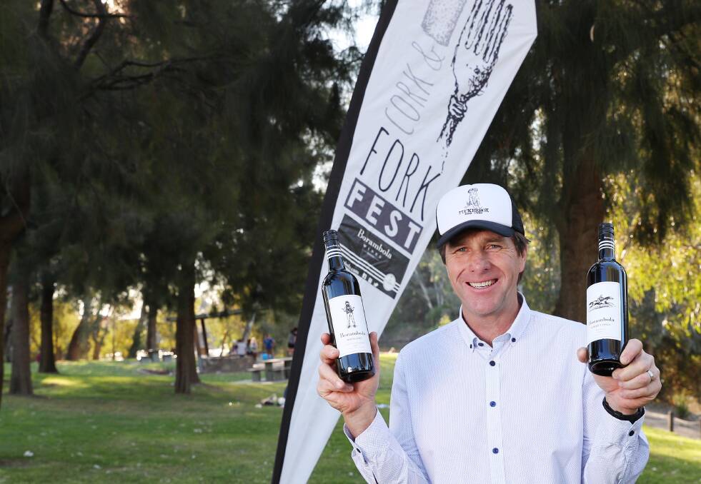 Throwback to 2017's Cork and Fork Festival with Tim McMullen holding some of his home grown wines from Borambola Wines. 