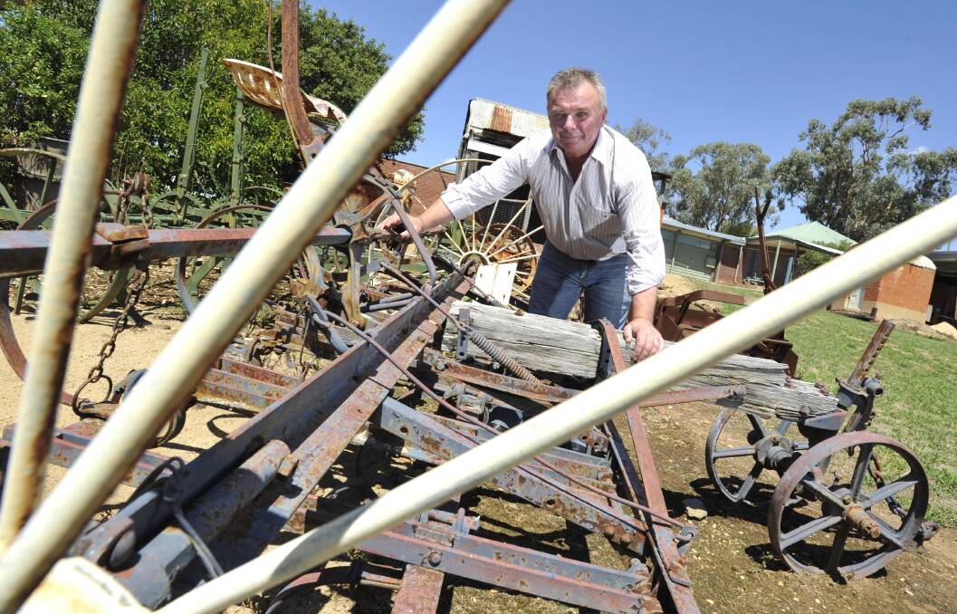 HISTORY: Museum manager Luke Grealy says the site's historic features, like the vintage cropping machine pictured, will be safely relocated while construction takes place. Picture: Les Smith