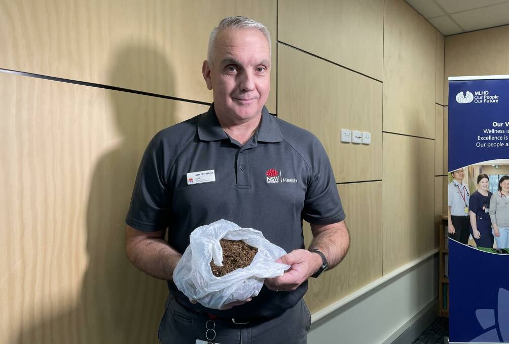 ILLEGAL: Ian Hardinge shows a sample of illegal loose tobacco product. Picture: Jessica McLaughlin