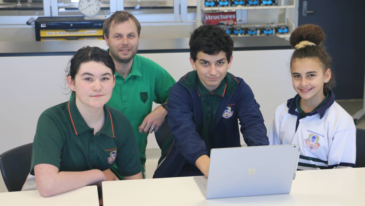 TECH-SAVVY: Teacher Isaac Mannion with year 8 STEM students Olivia Harding, Jack Stanton and Karin Rezkalla. Picture: Jessica McLaughlin