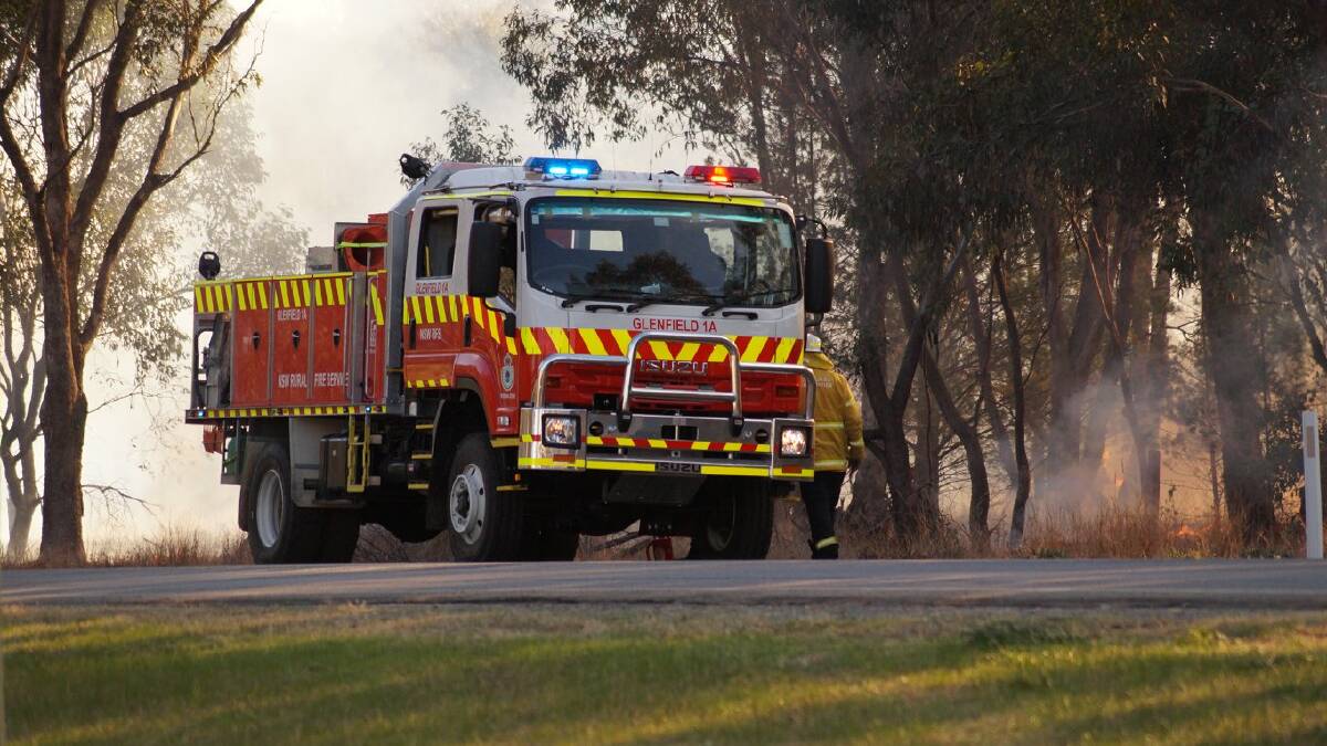 ON DUTY: Riverina Rural Fire Service crews work to extinguish a grassfire at Coolamon. Picture: NSW RFS