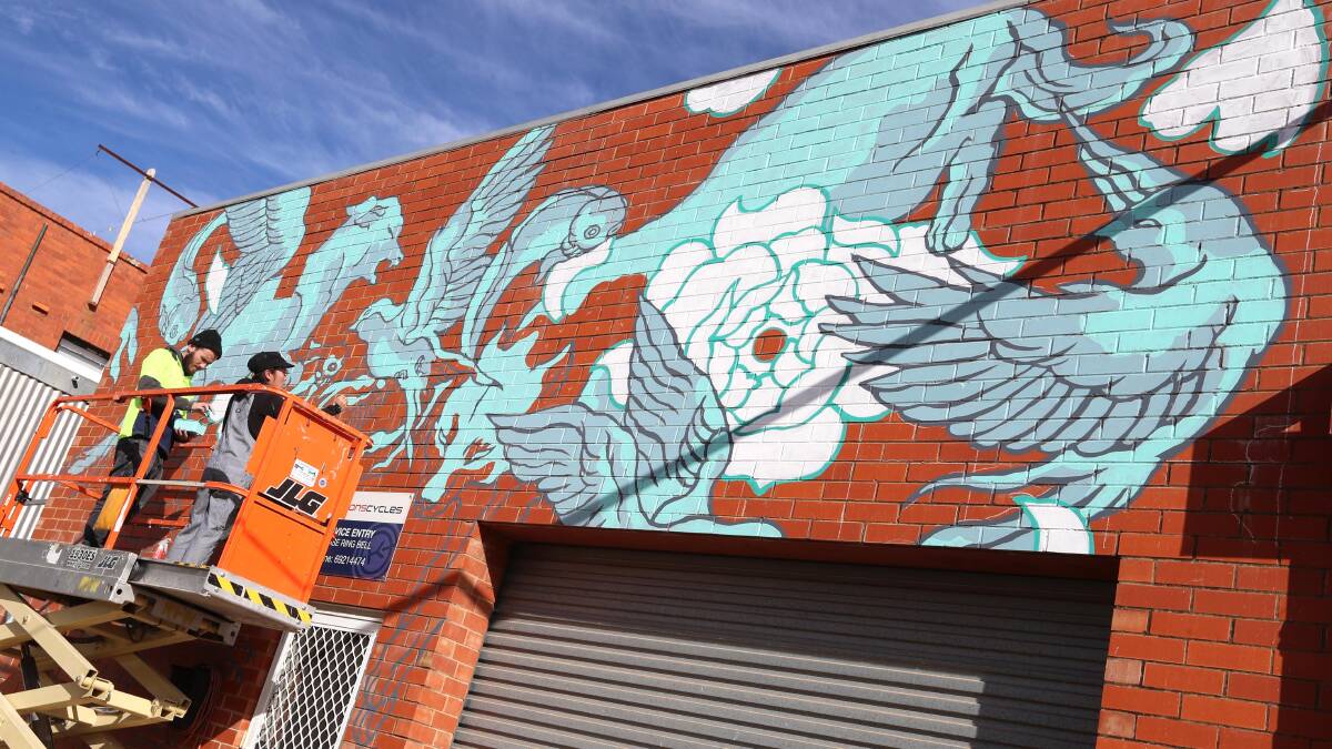 The mural features animals like birds, fish and wolves. Picture: Les Smith