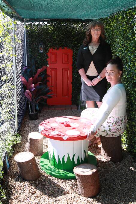 PLAY TIME: Nicky Ward-Martinelli shows Amanda Russell the fairy garden play space she created for the children to enjoy. Picture: Les Smith