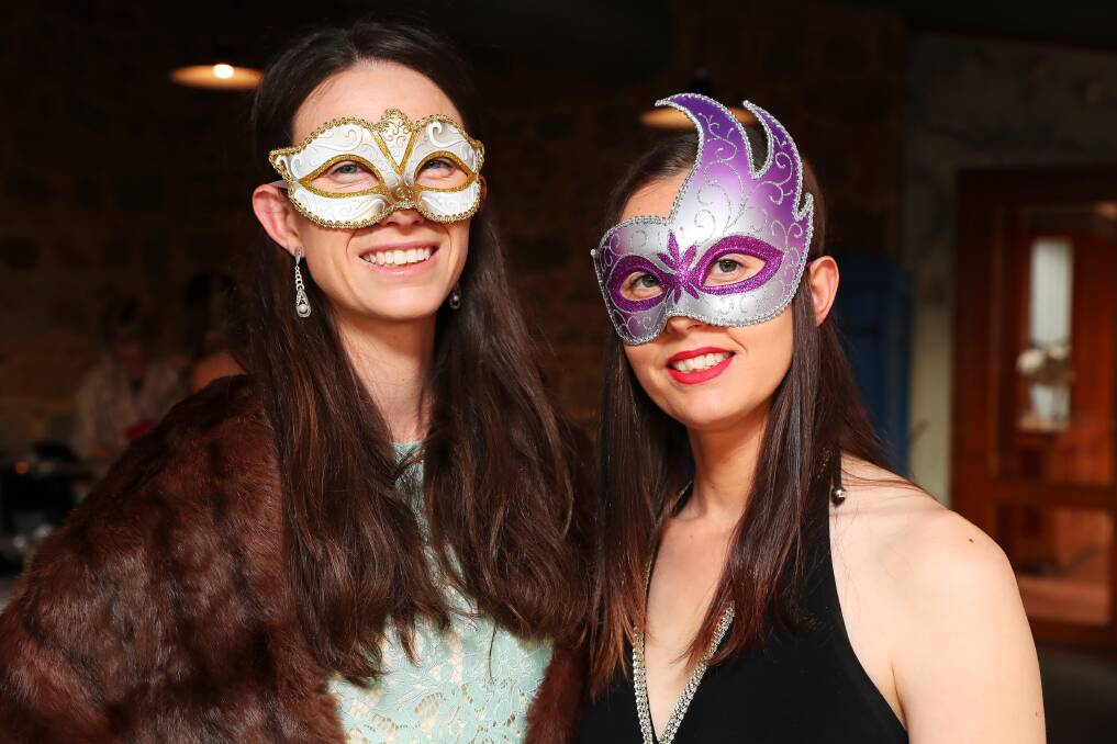 LAST HURRAH: Sophie Mason and Nicole Irons keep it classy with dainty masks. Picture: Emma Hillier