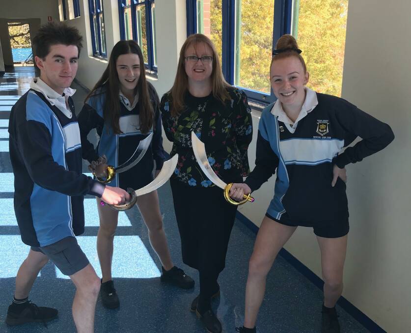 GIANT LEAP: Year 12 students Rex Gallaher, Emilia Campbell and India Becroft have pinpointed their target - Ms Maddison - for the Walk the Plank challenge. Picture: Contributed