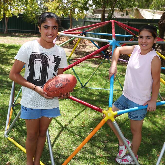 TEAMWORK: Rozaliya Hasan, 12, and Shireen Khalti, 12, say they can't wait for the new sport program to start up in February. Picture: Emma Hillier