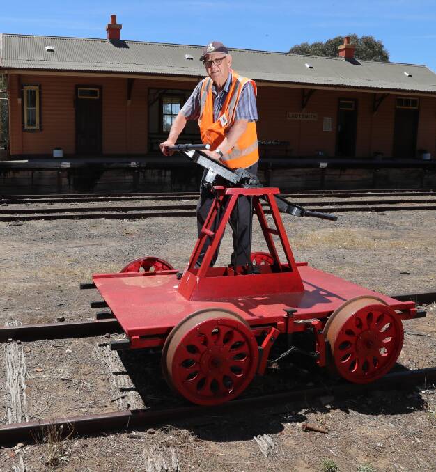 HISTORIC: Wally Bell of Ladysmith Railway poses with a hand car pump trolley - one of many pieces of history on exhibit at the museum. Picture: Les Smith