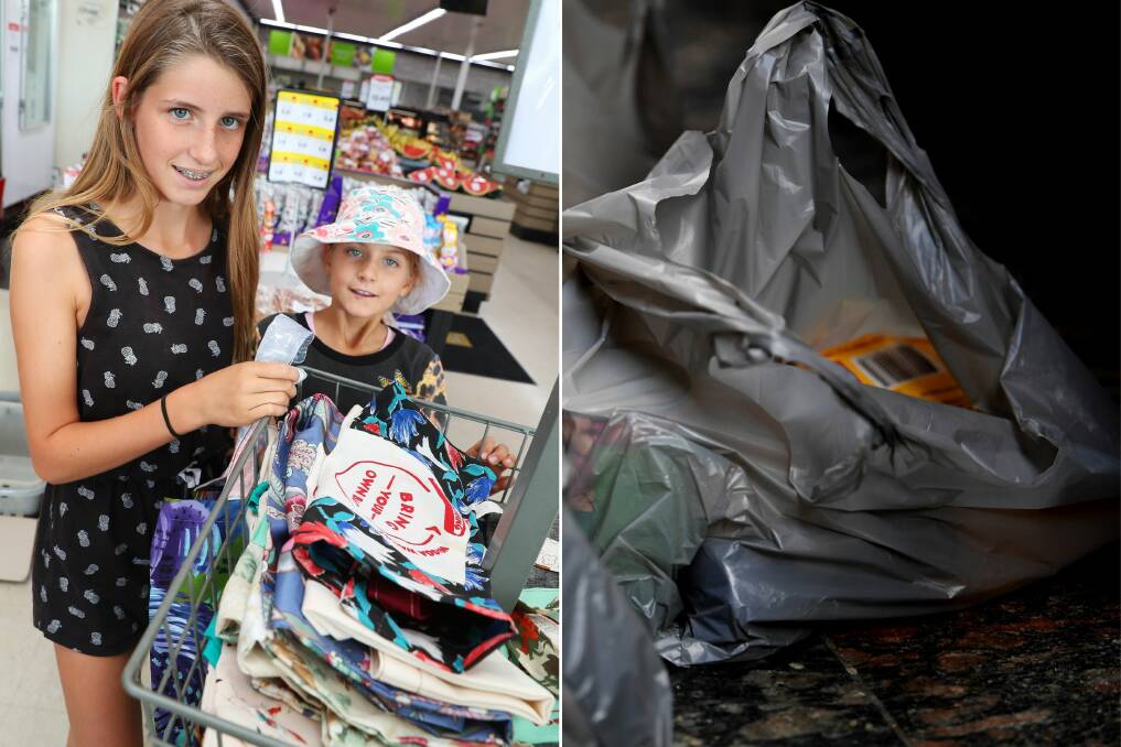 Lissette Baverstock, 12, and Emily Baverstock, 10, grab their own reusable Boomerang Bag instead of a plastic alternative.