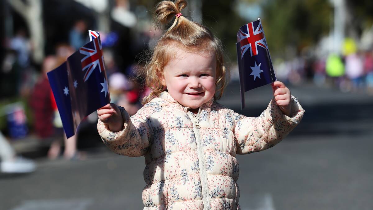 SPIRIT LIVES ON: Two-year-old Imogen Frost shares in the Anzac Spirit as she waits to cheer on those marching down Baylis Street. Picture: Emma Hillier