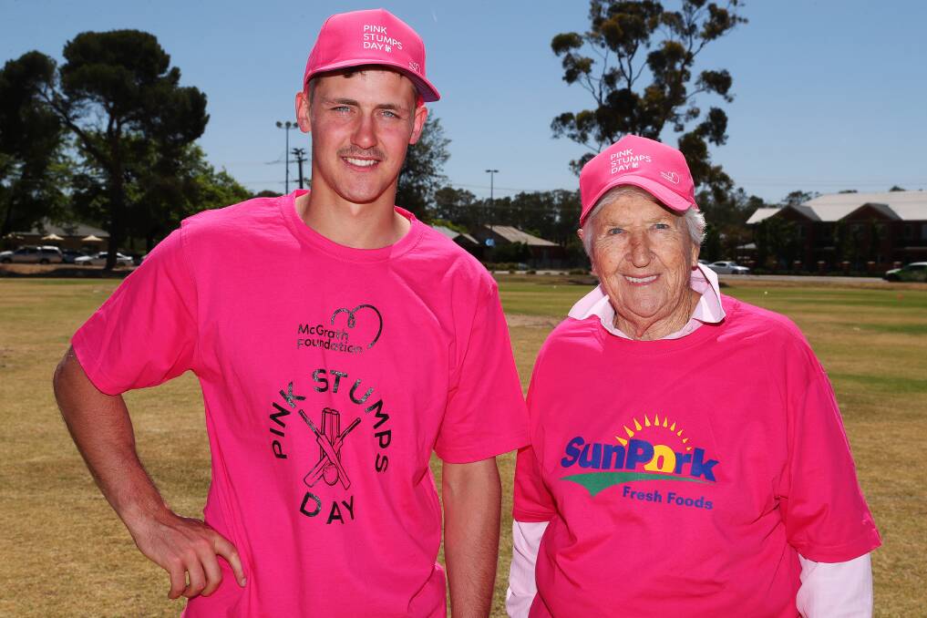FAMOUS FACES: GWS Giants star Harry Perryman and Australia's champion swimmer Dawn Fraser teamed up to try their hand at cricket for Pink Stumps Day in Wagga. Picture: Emma Hillier