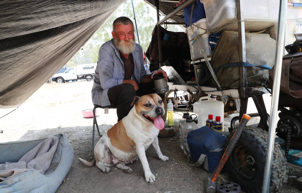 INSPIRATIONAL: Paul Murcott with hid dog RJ stop in at Wagga's Wilks Park towards the end of his long journey to raise awareness. Picture: Emma Hillier