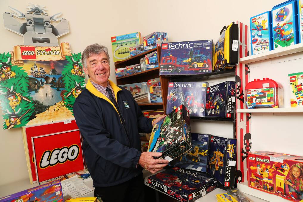 COLLECTORS ITEMS: Country Hope's Tom Looney browses some of the more vintage pieces to James' Lego collection. Picture: Emma Hillier