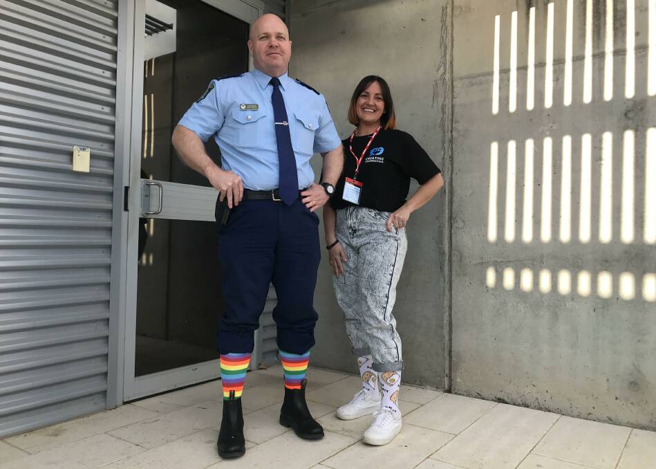 SUPPORTIVE: Superintendent Bob Noble and Wellways Wagga's Fran Godde show off their best socks to raise awareness for mental health. Picture: Jessica McLaughlin