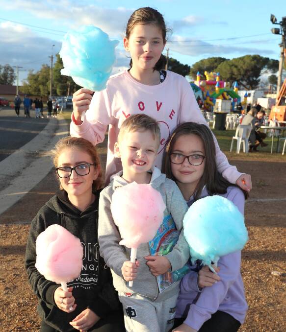 Cameron Broom, 5, with (L) Stacey Mewburn, 14, Simone Broom, 11 and Alisha Sayers, 14, at last year's Aussie NightMarkets. Picture: Les Smith