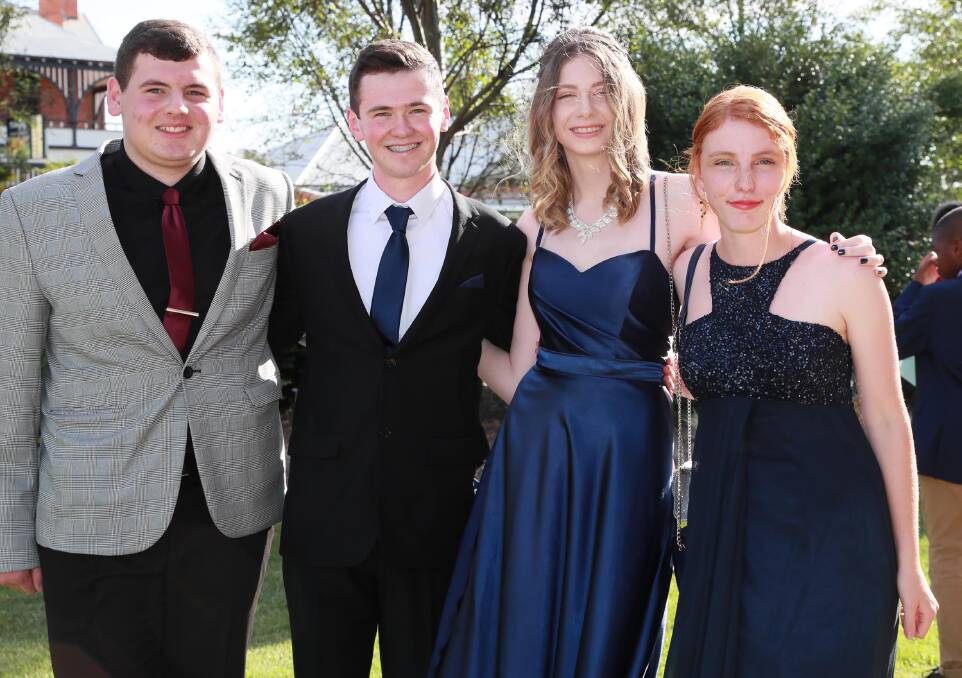 COORDINATED: Jordan Hawke, Callum Atwell, Brianna Aplin and Rebecca Scott opted for navy blues and maroons when choosing their outfits, giving off a classy vibe. Picture: Les Smith