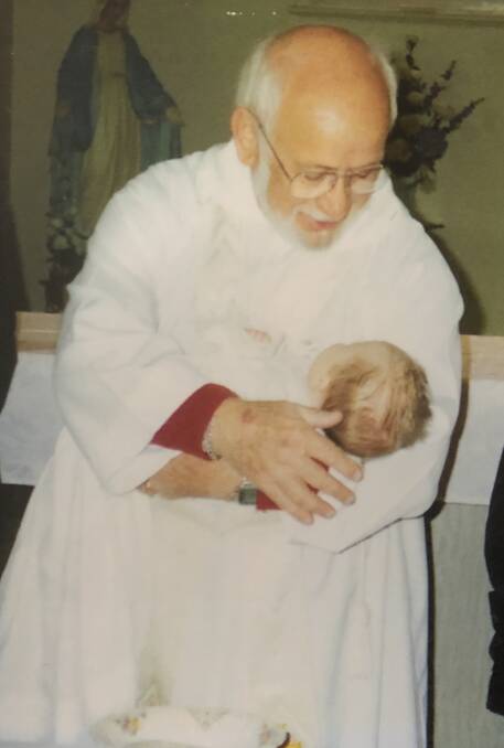 Father Norm was able to baptise his own great-granddaughter. Picture: Supplied