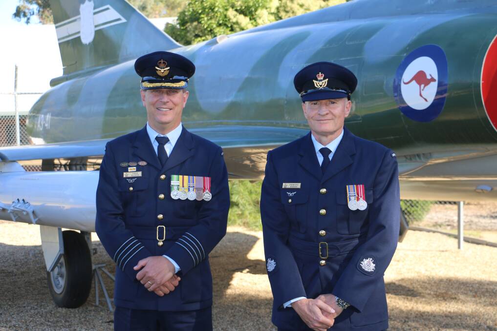 PROUD: RAAF Wagga Base Group Captain Chris Ellison and Warrant Officer Des Byrnes join the day's celebrations at Government House before returning to mark the milestone with fellow Wagga servicemen and women.