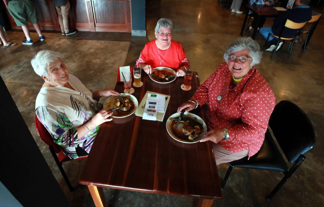SUNDAY ROAST: Joan Skews, Sandra Rootes and Noelene Hogan enjoy their freshly prepared lunch at the Thirsty Crow for the first Goodwill Eating event to raise money for Carevan. Picture: Les Smith