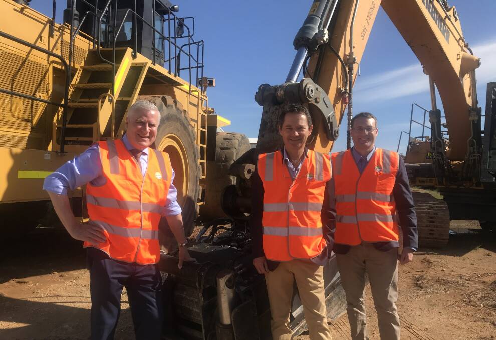 ON THE MAP: Michael McCormack checks out the machinery manufactured in Wagga with Flip Screen's Sam Turnbull and Daniel Jones. Picture: Jessica McLaughlin