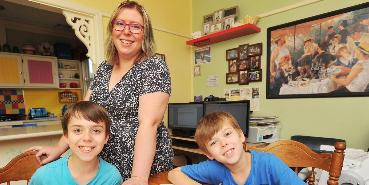 "HOMEROOM": Laurelle Lewis homeschools her children, Christophers Forbes (left) and Noah Forbes, who are performing much better in the home environment than the school yard. Photo: Kieren L. Tilly. 