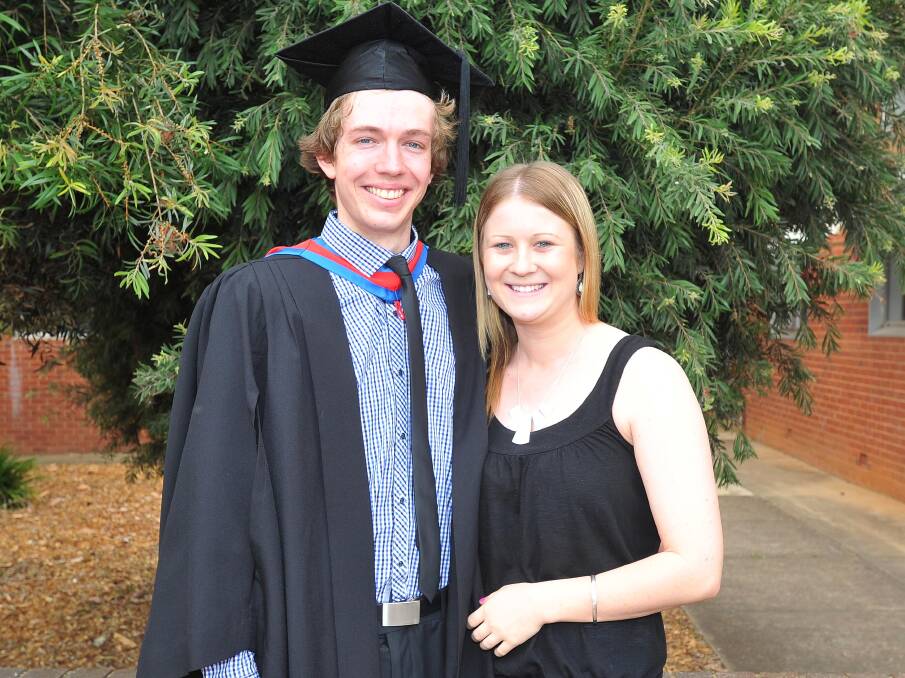 GRADUATING GLEE: Graduate Benjamin White from Wagga with Michelle Connelly from Griffith.
